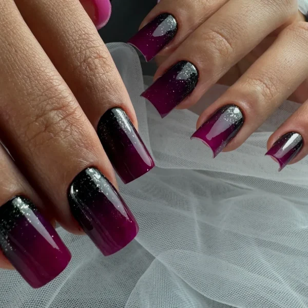 Burgundy ombre nails with a coffin shape and a glossy finish.