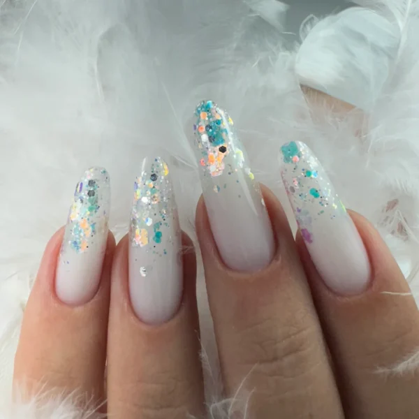 Almond-shaped nails with a white base and glitter accents.