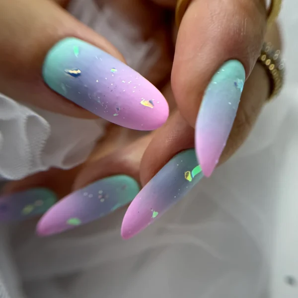 Ombre pastel almond nails blending soft pink and blue tones.