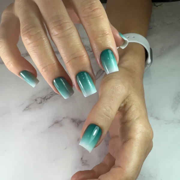 Square-shaped turquoise nails with a glossy finish.